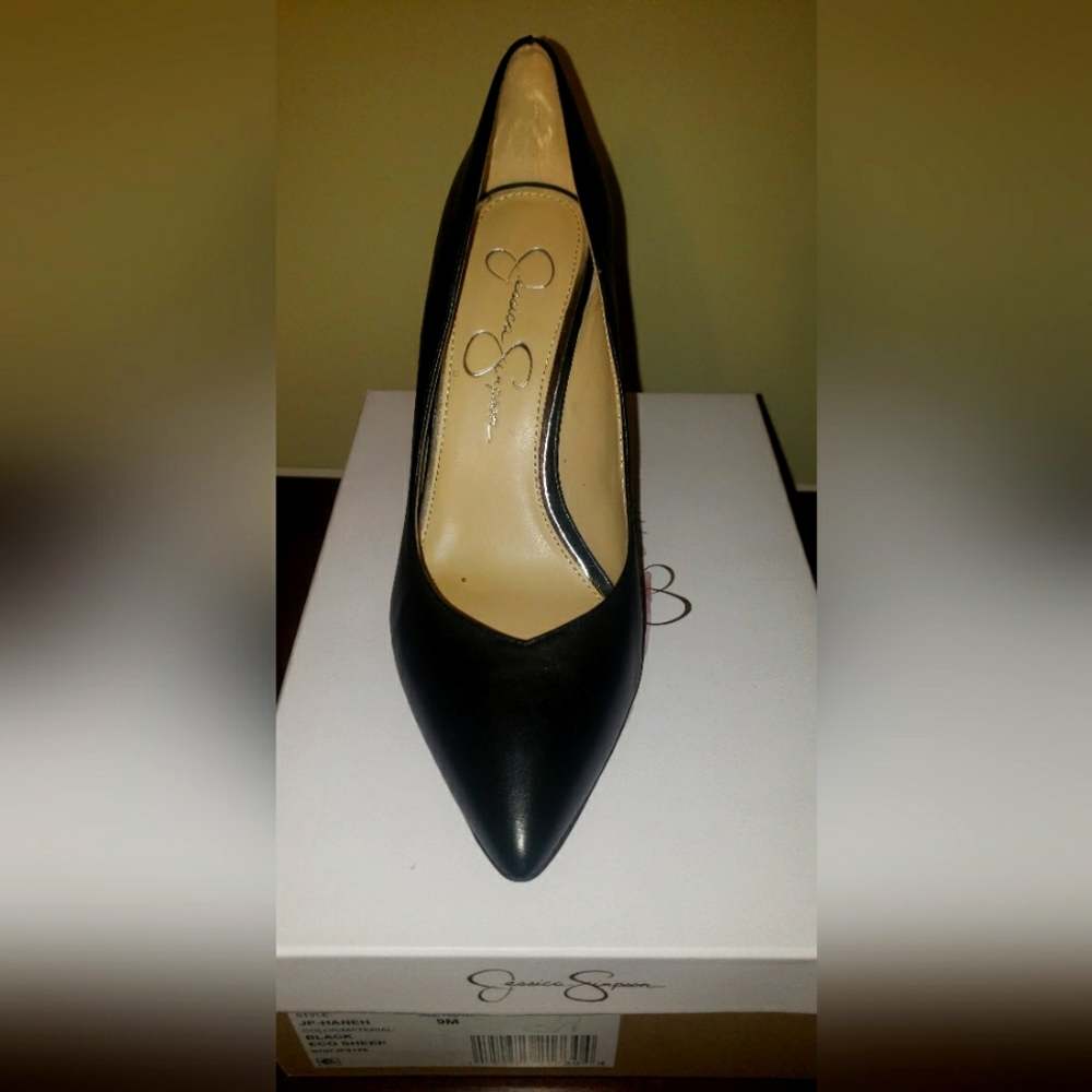 Black leather pumps